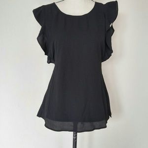 Ruffle cap sleeves and a high neck printed blouse.